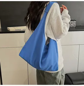 Rear view of a large Klein blue canvas tote bag showing its spacious capacity and drape