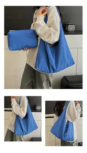 Detailed set of Klein blue canvas tote bag and matching pouch for casual daily use