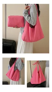 Pink canvas tote bag set with matching makeup pouch and soft shoulder strap detail