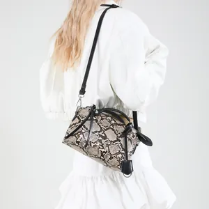 Fashionable snake skin print tote bag with black handles and adjustable shoulder strap