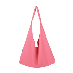Minimalist pink canvas tote bag with large capacity and triangular silhouette