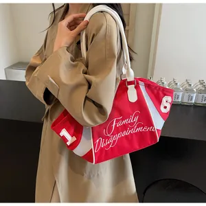 Side view of red and white mesh拼接 tote bag worn by model with khaki trench coat