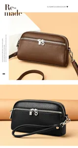Détail de sacs bandoulière multicouches en cuir noir et marron avec fermetures éclair argentées