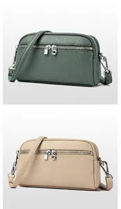 Détails du petit sac bandoulière multicouche en vert thé et abricot avec fermetures