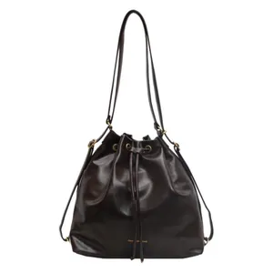 Brown leather drawstring bucket bag with adjustable strap and golden fashion text