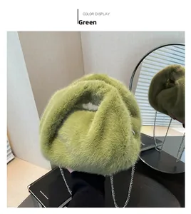 Close-up of fluffy green faux fur bucket bag with a stylish silver metal chain strap