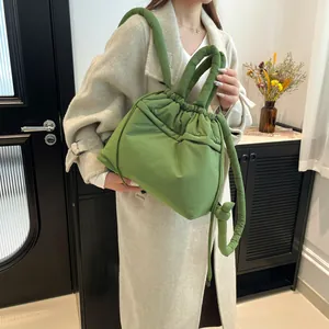 Large grass green padded tote bag made of lightweight nylon with stylish knot detail