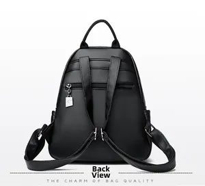 Back view of black leather backpack with adjustable straps and anti-theft pocket