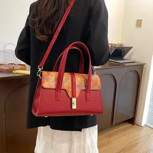 Retro red embossed shoulder bag for women with orange art print and gold clasp lock