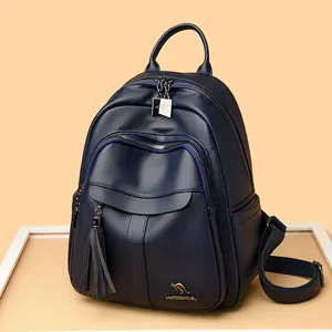 Dark blue pebbled leather backpack for women with kangaroo logo and tassel details