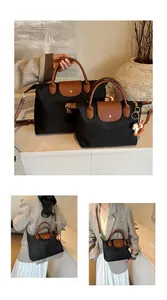 Detailed close-up of nylon tote bags featuring leather handles and a horse charm pendant