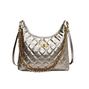 Chic silver quilted saddle bag with gold chain strap and turn-lock for women