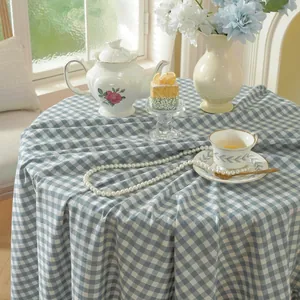Blue and white gingham washed cotton tablecloth for round tables with a natural drape