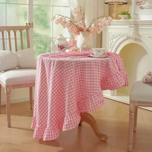 Pink gingham cotton tablecloth with ruffled edges for rustic round dining table decor