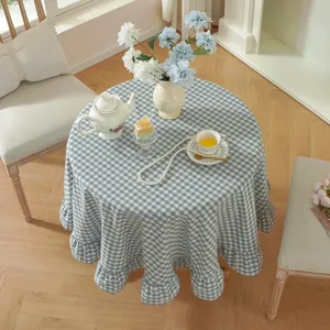 Blue and white checkered round tablecloth featuring elegant ruffled edge detail