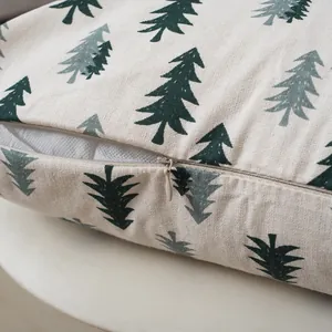 Detail of hidden zipper and linen texture on a Christmas tree pattern cushion cover