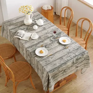 Detailed close-up of vintage grey wood grain linen tablecloth with rustic props