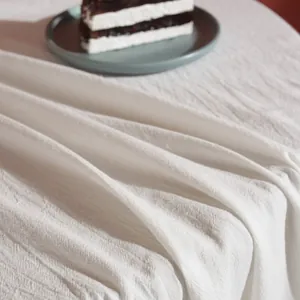 Minimalist cream white waffle weave cotton tablecloth with textured honeycomb pattern