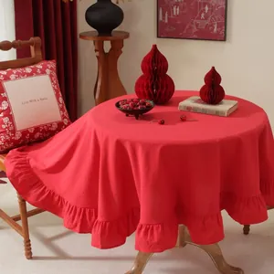 Luxurious red round tablecloth with elegant ruffled edges for dining room home decor