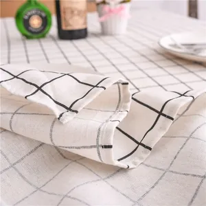 Close-up of black and white plaid tablecloth showing woven cotton linen fabric texture