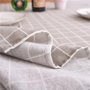 Detail shot of the cotton linen blend fabric with a grey and white checkered pattern