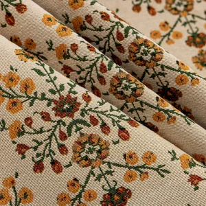 Detailopname van de Boheemse jacquardstof met vintage oranje en gele bloemenpatronen