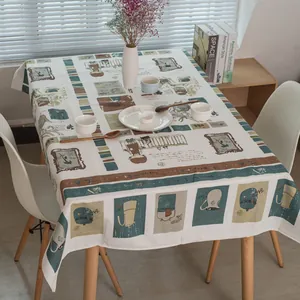 Détail du motif d'illustration rétro sur nappe en lin avec motifs café et personnages