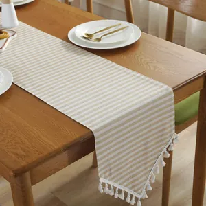 Striped cotton linen table runner with elegant white tassels for modern home dining decor