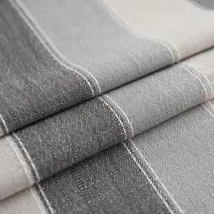 Macro shot of Nordic striped waterproof tablecloth featuring gray linen texture and stitching