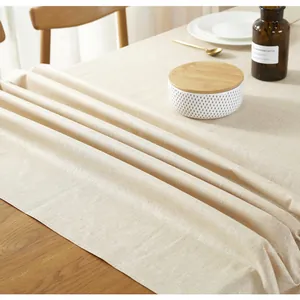 Dettaglio ravvicinato della tovaglia in lino beige impermeabile con trama intrecciata