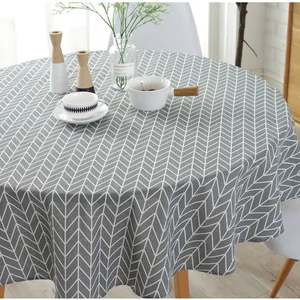 Detailed view of grey and white herringbone pattern cotton linen round tablecloth