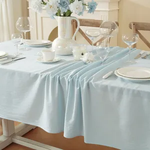Light blue cotton linen tablecloth with elegant texture for a French minimalist dining setup