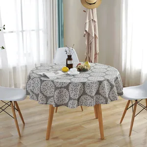 Nordic round grey tablecloth with white mandala print in a minimalist home setting