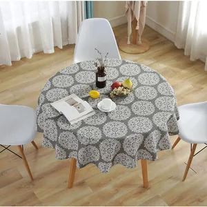 Detail of grey tablecloth with white mandala patterns and soft cotton-linen texture