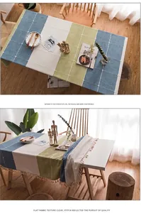 Dettaglio ravvicinato della tovaglia in cotone e lino grigio con strisce e nappe decorative