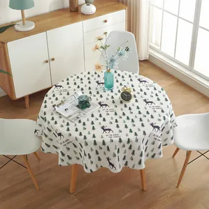 Detail of Nordic round tablecloth with pine and deer print on cotton linen fabric