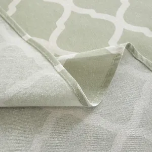 Detail of green clover geometric pattern on durable linen cotton tablecloth fabric