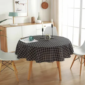 Close-up of black and white checkered round tablecloth made of cotton linen fabric
