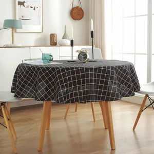 Detailed texture of round cotton linen tablecloth with classic black and white grid pattern