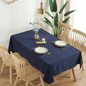 Close-up of dark blue cotton tablecloth with natural texture and fine stitching