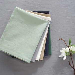 Sets de table en lin multicolores avec branche de magnolia décorative