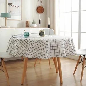 Detail of round cotton linen tablecloth with classic black and white checkered pattern