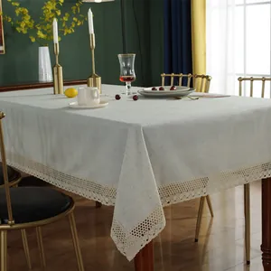 Minimalist beige linen tablecloth featuring elegant wide lace edges for dining home decor