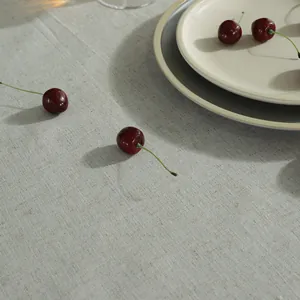 Detailed macro view of beige linen tablecloth fabric texture with natural fibers