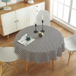 Macro shot of circular cotton linen tablecloth with black and white geometric triangle pattern