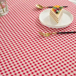 Detail of red and white checkered cotton linen tablecloth with a rustic texture