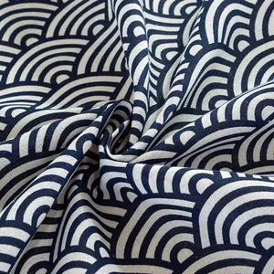 Detailed macro view of Seigaiha wave pattern fabric with premium cotton linen texture