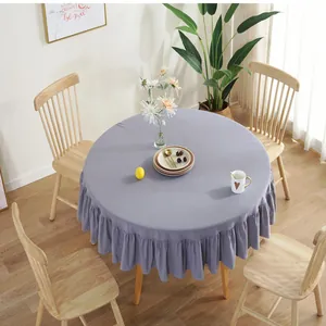 Detailed close-up of the ruffled edges and linen texture of this lavender round tablecloth