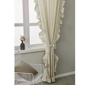 Nordic minimalist cream-colored ruffled curtain with elegant beaded tieback in a cozy room