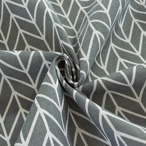 Macro shot of dark grey cotton linen fabric with white herringbone geometric pattern